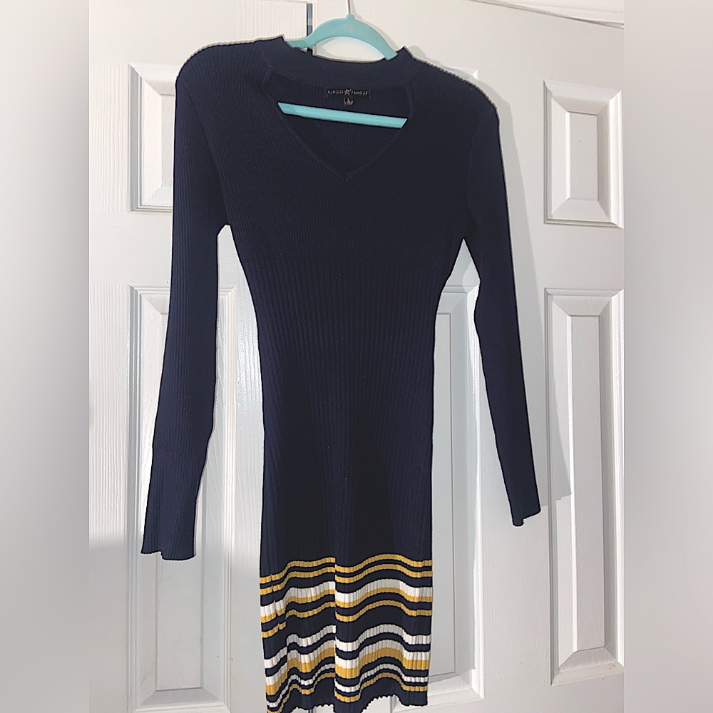Navy blue sweater dress/ yellow and white stripes at the bottom